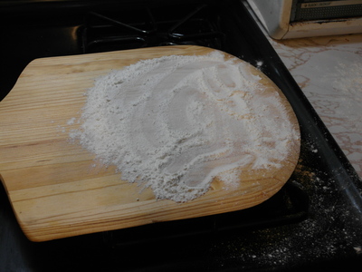 Flour a pizza paddle