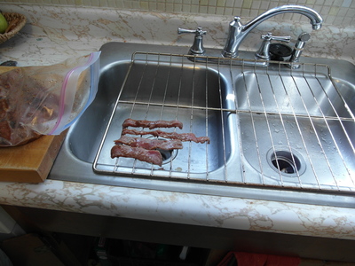 Beef strips on oven grate