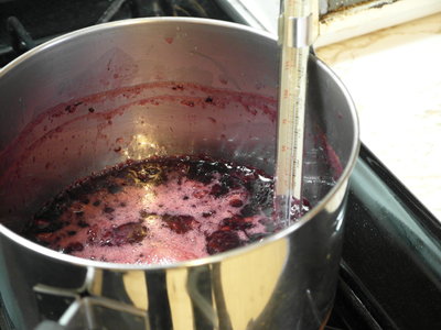 Simmer to reduce fruit preserves