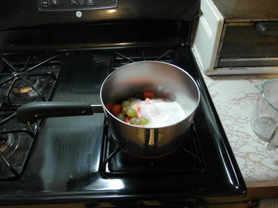 Sugar and fruit in pot