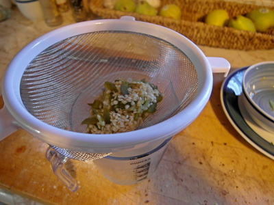 Strain vinegar into measuring cup